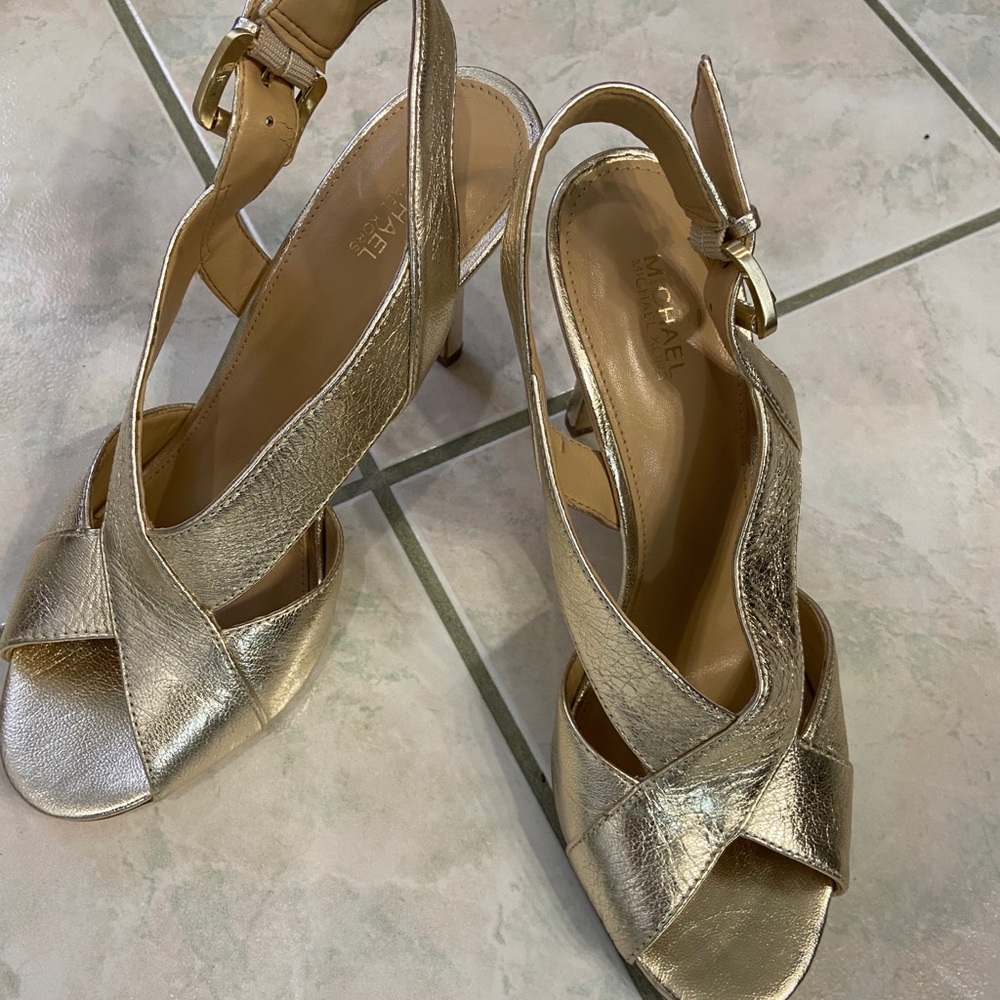 Gold peep toe high heel sandals by Michael Kors